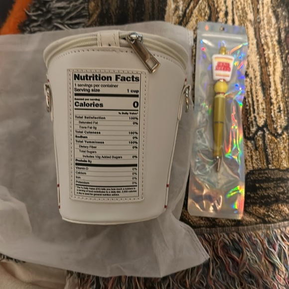 Brand new cute noodle’s crossbody with strap. - Picture 2 of 3